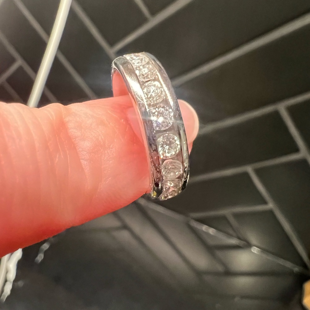 Size 5.5 white gold channel set diamond band.
